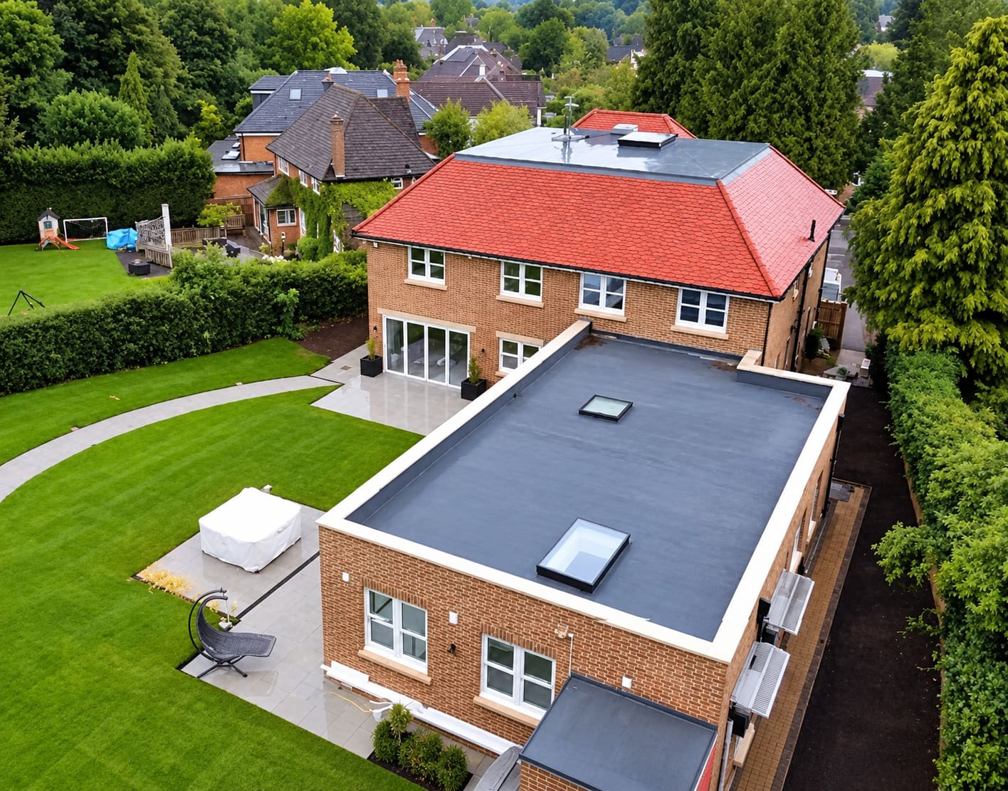 Aerial view of a large detached house with a new red tiled hipped roof