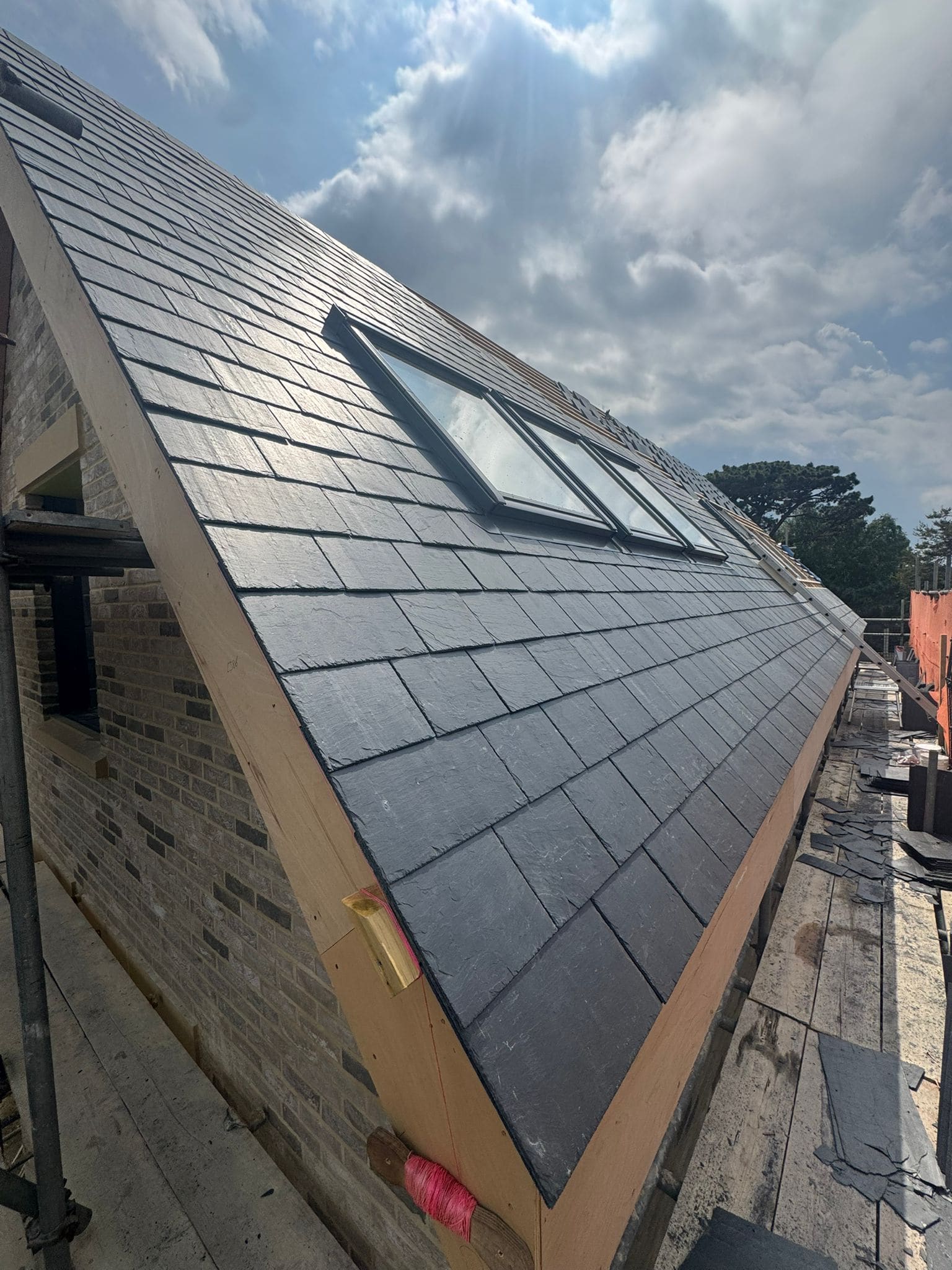 Roof windows fitted into a new slate roof