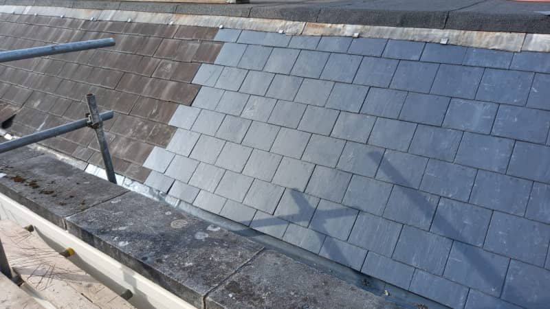 Slate roof under repair with scaffolding in place